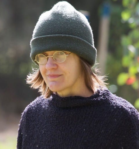 Diane Stubbings wearing a beanie and glasses in a dark sweater