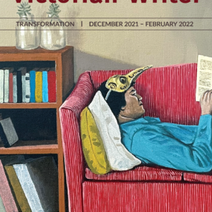 The text reads "The Victorian Writer, Transofmration. December 2021 February 2022." The image is a drawing of a man laying on a couchm proipped up by two cushgions. He wears a long beaked mask propped onto his forehead, and is reading a book. Behind him is a small bookshelf with some books and plants.